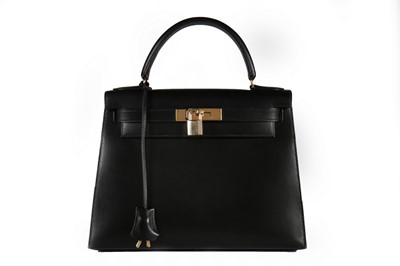 Lot 25 - An Hermès black leather Kelly bag, 1993, blind...