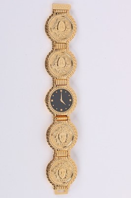 Lot 16 - A Gianni Versace gold plated wrist watch,...