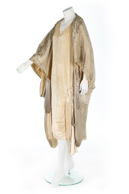 Lot 64 - A gold lamé cocoon-like opera cape, mid 1920s,...