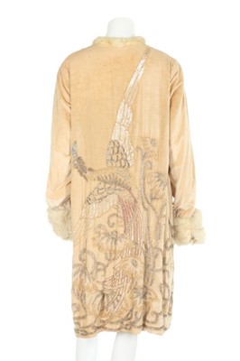 Lot 57 - A lavishly beaded ivory velvet opera coat,...