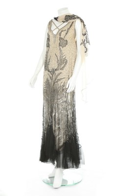 Lot 97 - An ivory crêpe georgette and chantilly lace...