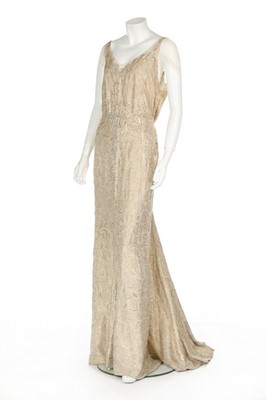 Lot 92 - A Norman Hartnell couture ivory and gold...