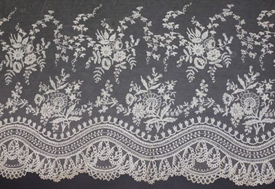 Lot 318 - A Brussels bobbin appliqué dress flounce, 1860-...