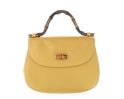 Lot 85 - A Gucci leather 'bamboo' handbag, 1990s,...