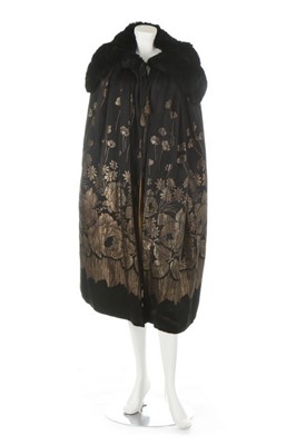 Lot 88 - A Liberty gold brocaded black satin opera cape,...
