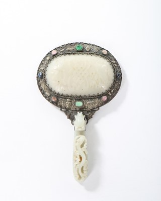 Lot 194 - A Chinese elaborately carved hardstone mirror...