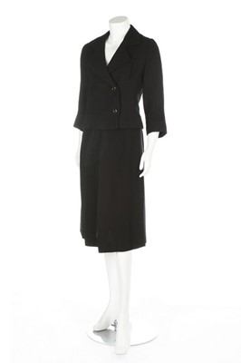 Lot 246 - A Balenciaga couture black boucle wool suit,...