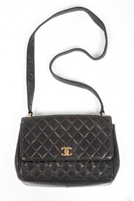 Lot 254 - A Chanel dark brown quilted leather handbag,...