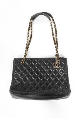 Lot 255 - A Chanel black leather quilted shopper, 1980s,...