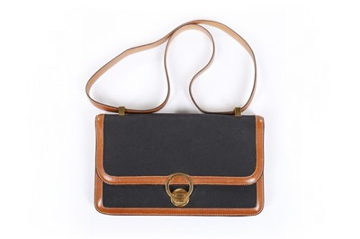 Lot 258 - An Hermès navy canvas and leather 'Ring'...