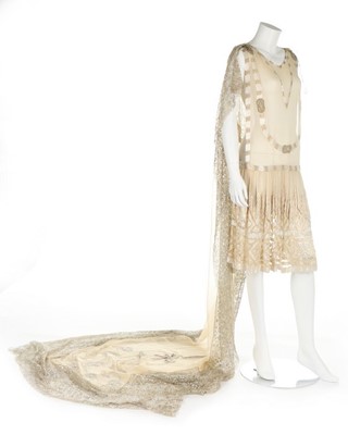 Lot 268 - A beaded and embroidered couture ivory chiffon...