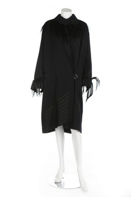 Lot 276 - A Stone & Thomas navy gabardine coat, American,...