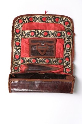 Lot 304A - A brown glacé leather sewing roll embroidered...