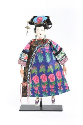 Lot 377 - A carved wooden Japanese doll wearing a...