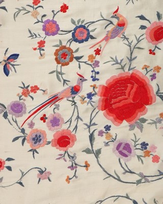 Lot 386 - An embroidered ivory silk shawl, Chinese,...