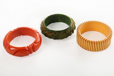 Lot 199 - A group of bangles, 1930s and later, approx 35,...