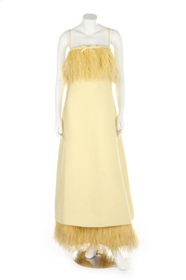 Lot 10 - A yellow gazar evening dress, circa 1967,...