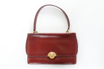 Lot 72 - An Hermès ox blood leather 'Tourniquet' bag,...