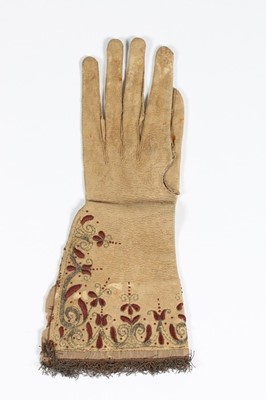 Lot 12 - A single buff leather glove, traditionally...