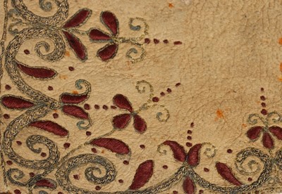 Lot 12 - A single buff leather glove, traditionally...