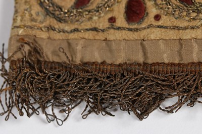 Lot 12 - A single buff leather glove, traditionally...