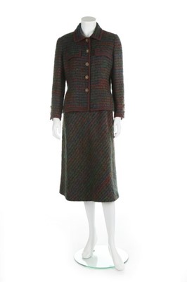 Lot 131 - A Chanel couture tweed suit, late 1970s,...
