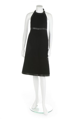 Lot 143 - A Courrges black wool crpe and vinyl edged...