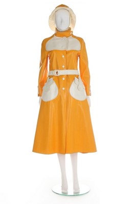 Lot 132 - A Courrèges yellow and white vinyl sou'wester...