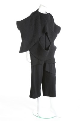 Lot 184 - A Comme des Garçons black knitted top,...