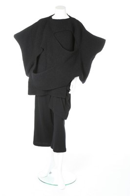 Lot 184 - A Comme des Garçons black knitted top,...