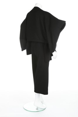 Lot 184 - A Comme des Garçons black knitted top,...