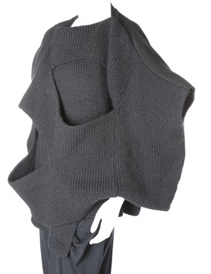 Lot 184 - A Comme des Garçons black knitted top,...