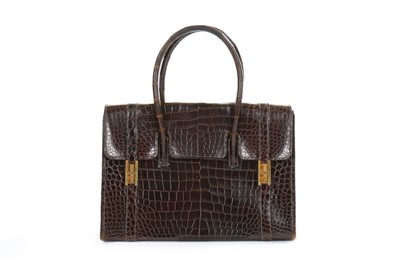 Lot 11 - An Hermès brown crocodile 'Drag' bag and...