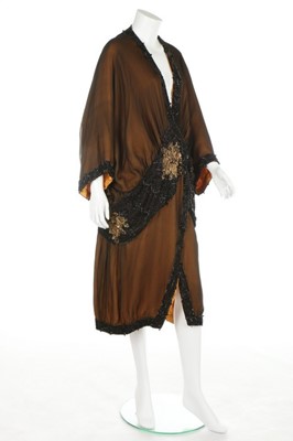 Lot 53 - A beaded opera coat, circa 1915-20, the...