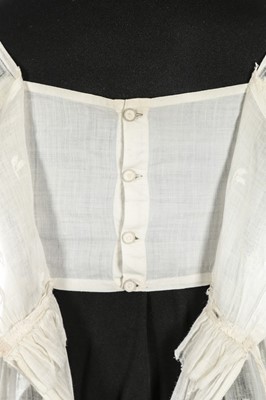 Lot 36 - A sprigged muslin dress, circa 1800, the...