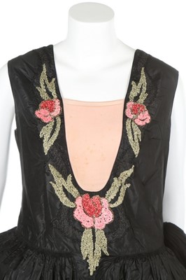 Lot 47 - A good ribbon-worked black taffeta robe de...