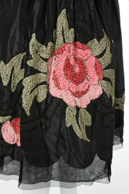 Lot 47 - A good ribbon-worked black taffeta robe de...