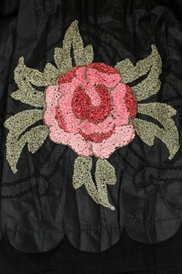 Lot 47 - A good ribbon-worked black taffeta robe de...