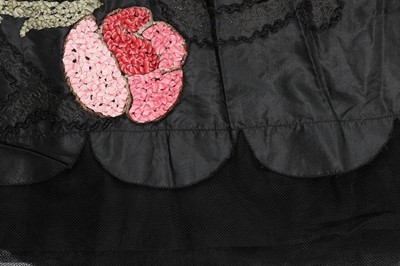 Lot 47 - A good ribbon-worked black taffeta robe de...