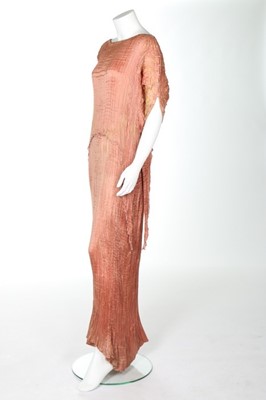 Lot 56 - A Mariano Fortuny rose pink silk Peplos dress,...