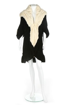 Lot 70 - A Paquin black velvet and white fur coat,...