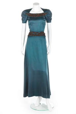 Lot 78 - An Elsa Schiaparelli peacock-blue silk jersey...