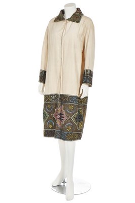 Lot 151 - An ivory linen-silk coat with Turkish...