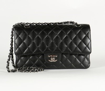 Lot 4 - A Chanel black caviar leather double flap bag,...