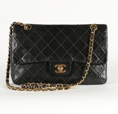 Lot 14 - A Chanel quilted black leather 2.55 bag, 1985,...