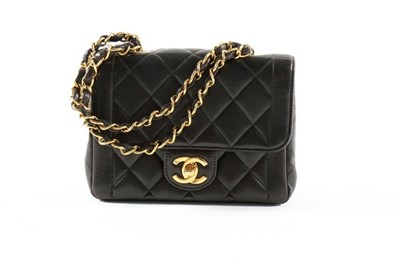 Lot 1 - A Chanel black quilted leather bag, 1990s,...