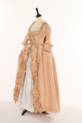 Lot 42 - An old-rose silk robe à la Française, 1770s,...