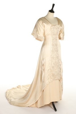 Lot 76 - A Liberty & Co ivory satin and silk crpe...