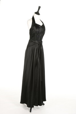Lot 93 - A Lucien Lelong black satin halter-neck...