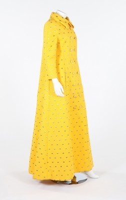 Lot 111 - A Galanos yellow ottoman and gold polka dot...
